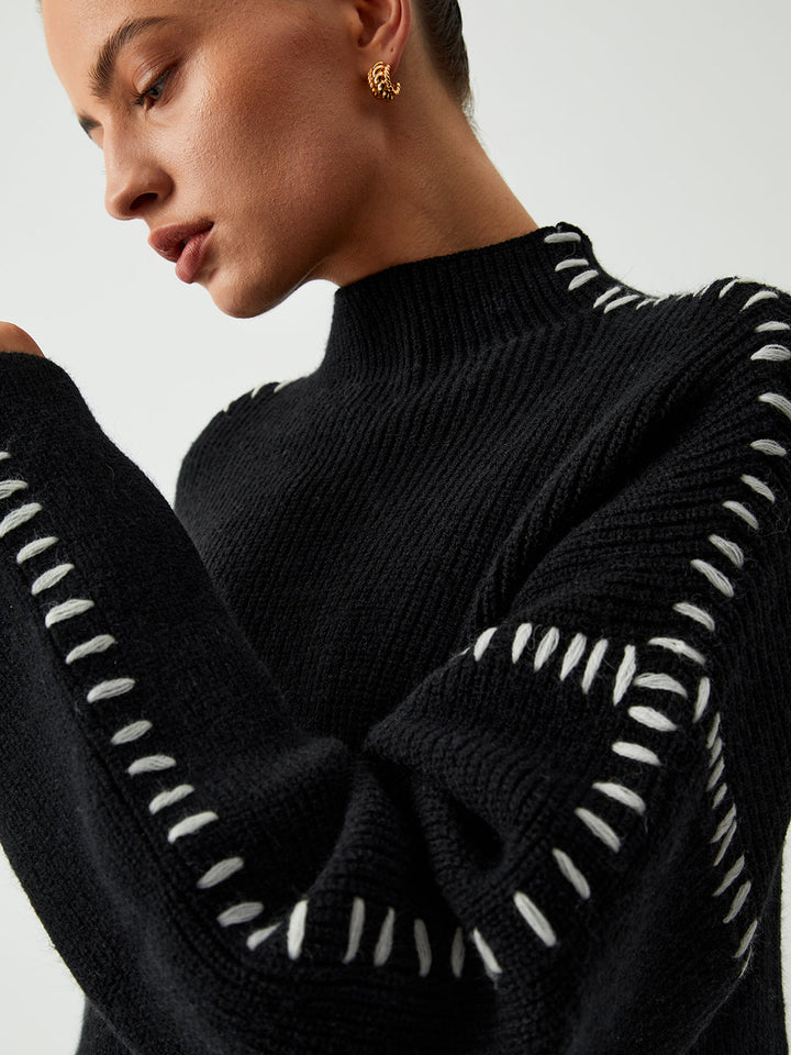Alma | Suéter oversize de cuello alto en piqué con detalles